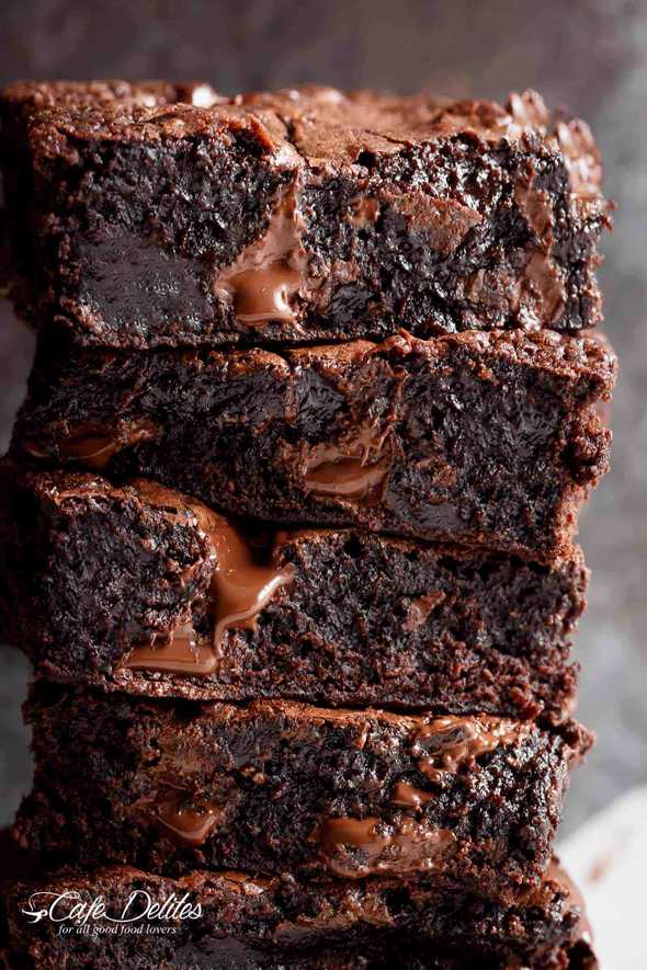 Gooey, fudgy chocolate brownies with melted chocolate dripping throughout